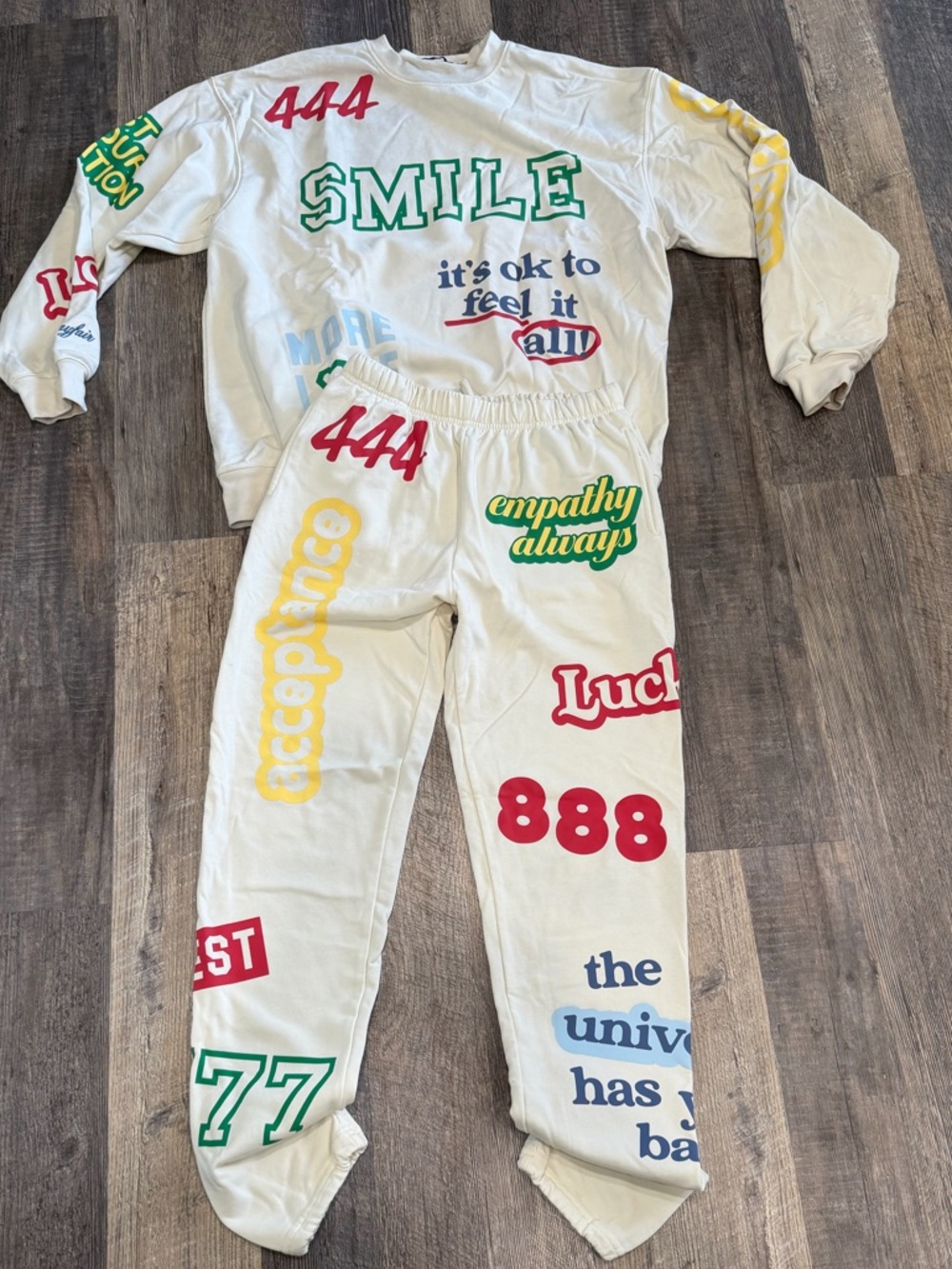 The Mayfair Group Graphic Cream Sweatshirt & Jogger Set with Multicolor Prints